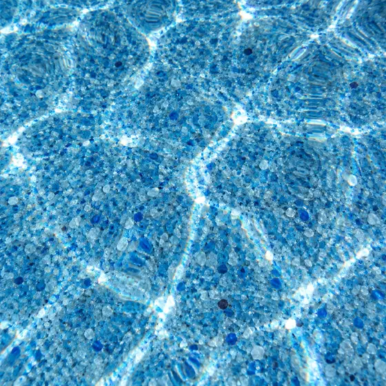 Blue quartz aggregate pool finish with sunlight ripples